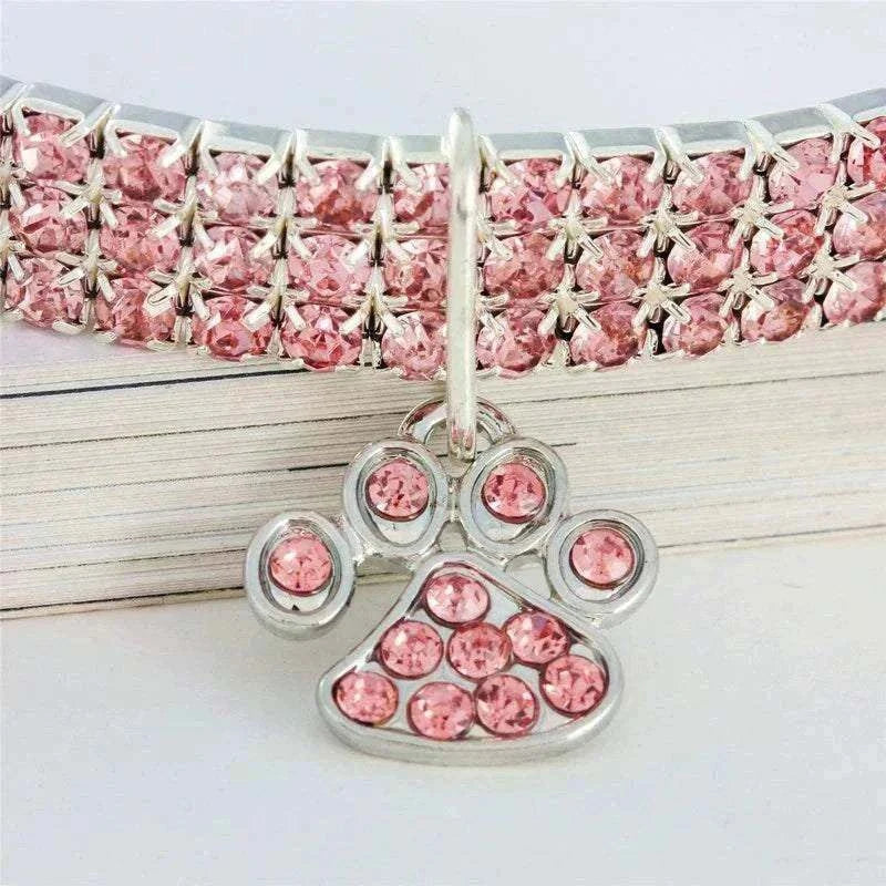 Pretty Kitty's Paw Pendant Cat Collar with pink rhinestone rows, silver-toned setting and a sparkling paw-shaped pendant