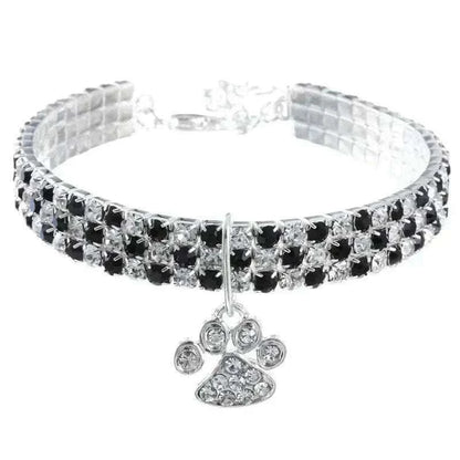 Pretty Kitty's Paw Pendant Cat Collar in silver-tone metal with rows of clear and black rhinestones and a sparkling paw charm