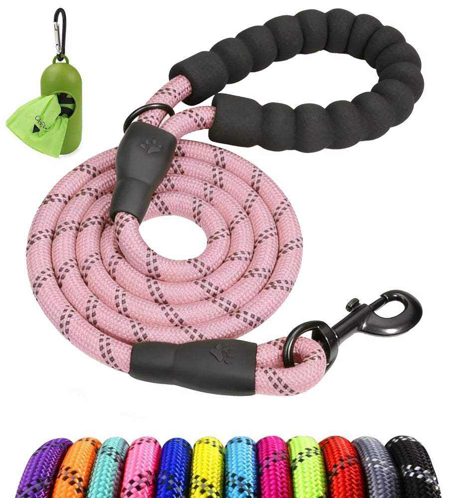 Single Rope Leash in pink braided rope with black padded handle and swivel clasp, shown with a green waste bag holder